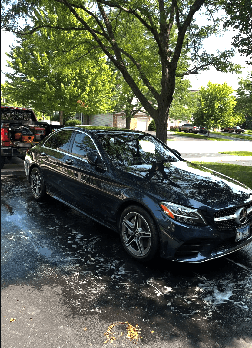 Freshly detailed Mercedes sedan in a driveway — SmartShine Mobile Detailing
